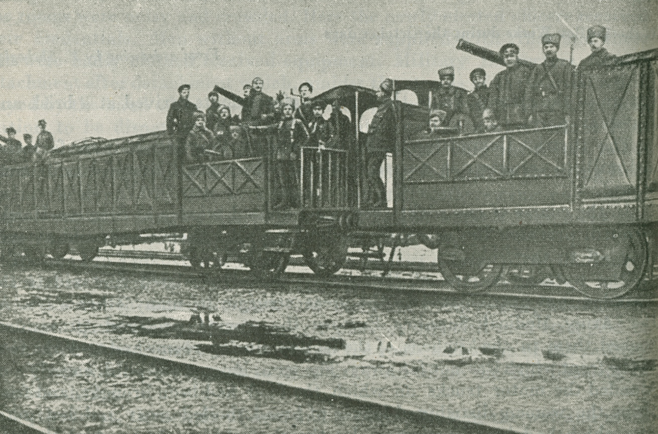 Photograph of soldiers riding on an armoured train